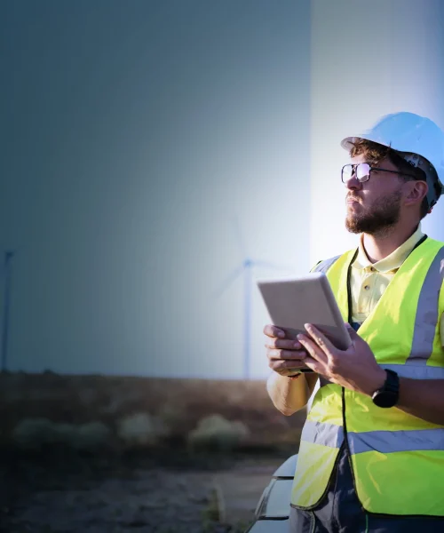 Onx-Blog-OnX-reaffirms-dedication-to-corporate-sustainability-man-in-hardhat-tablet-crop
